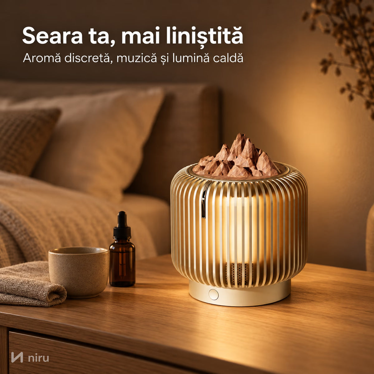 Difuzor de arome NIRU LumoAroma aprins pe noptieră, seara, lângă o sticluță de ulei esențial